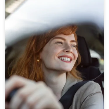 Woman driving a rental car