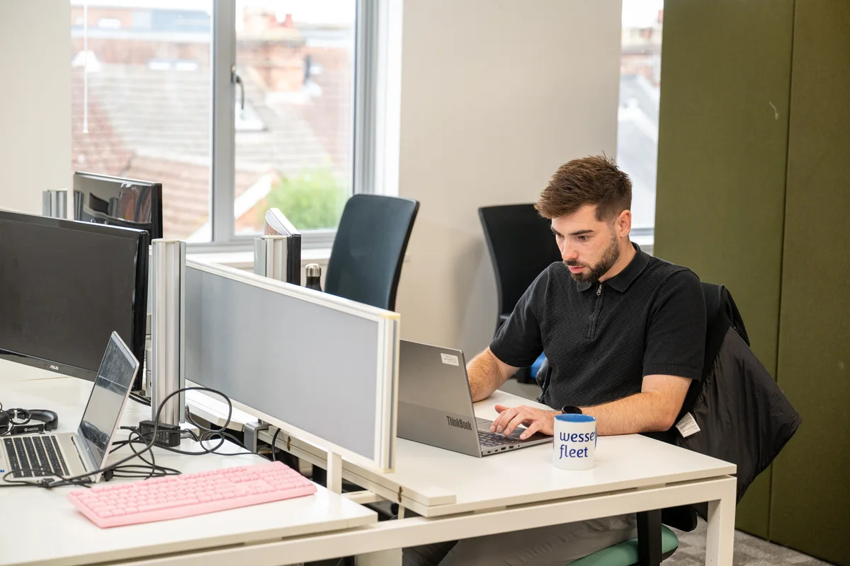 Wessex Fleet adviser working at a laptop
