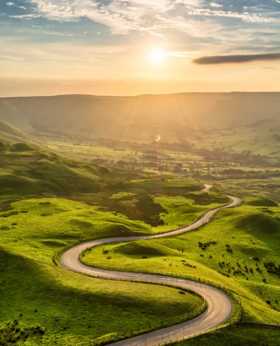 Winding road through green countryside