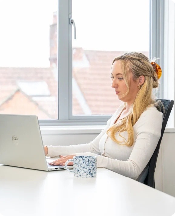 Wessex Fleet adviser working at a laptop