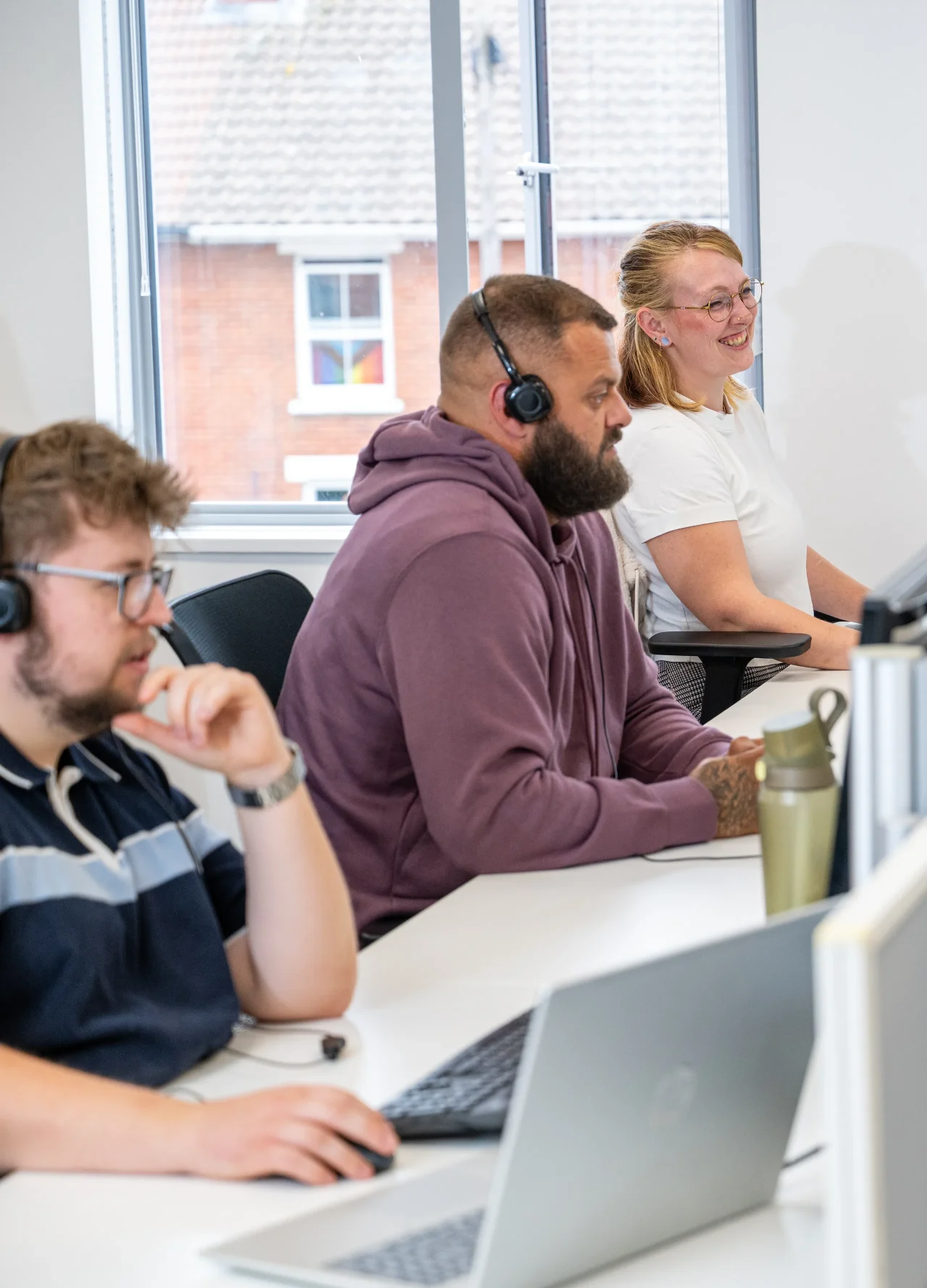 Three Wessex Fleet team members working in the office